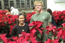 Students with poinsettias
